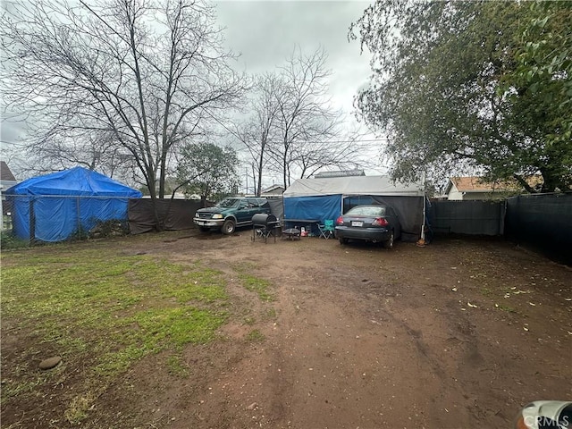 view of parking featuring fence