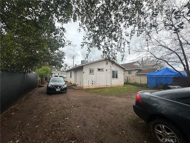 view of side of property with fence
