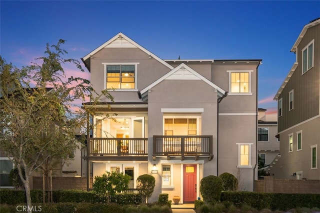 15 Vasto St, Rancho Mission Viejo, CA 92694 - view of front of home with fence, stucco siding, and a balcony