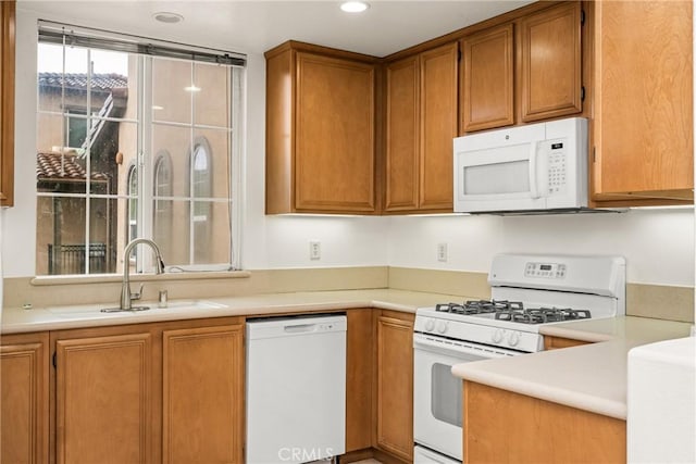 24 Dietes Ct, Ladera Ranch, CA 92694 - kitchen with white appliances, a sink, light countertops, brown cabinetry, and recessed lighting
