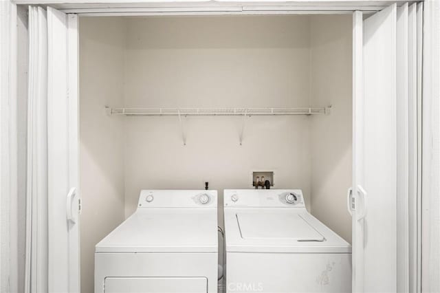 laundry area with independent washer and dryer and laundry area