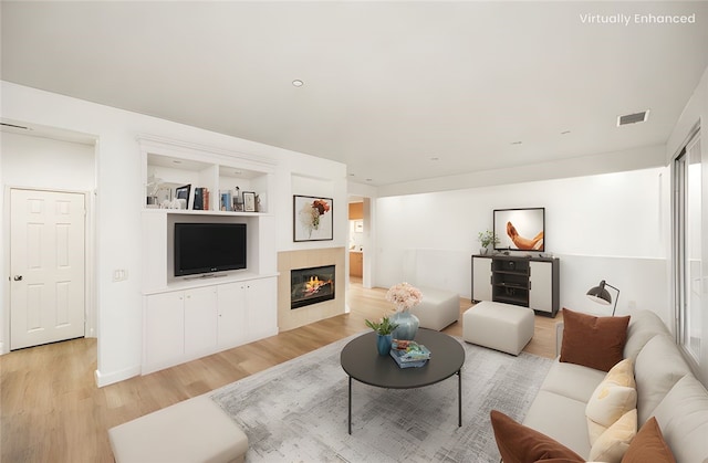 24 Dietes Ct, Ladera Ranch, CA 92694 - living room with light wood-style floors and a glass covered fireplace