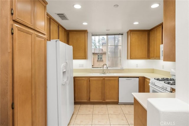 24 Dietes Ct, Ladera Ranch, CA 92694 - kitchen with white appliances, a sink, recessed lighting, brown cabinets, and light tile patterned flooring
