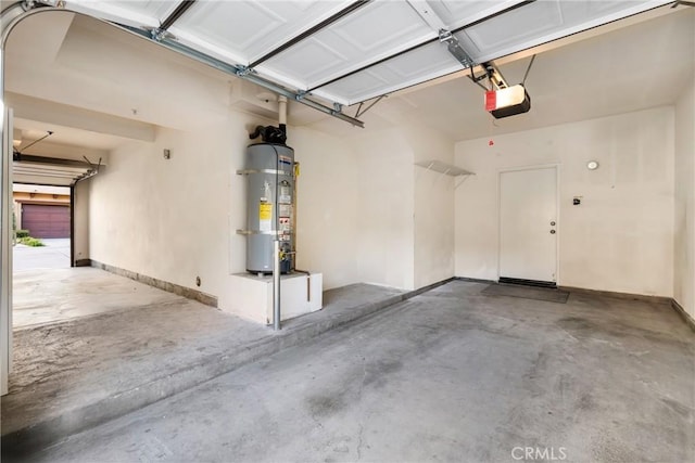 garage featuring a garage door opener and water heater