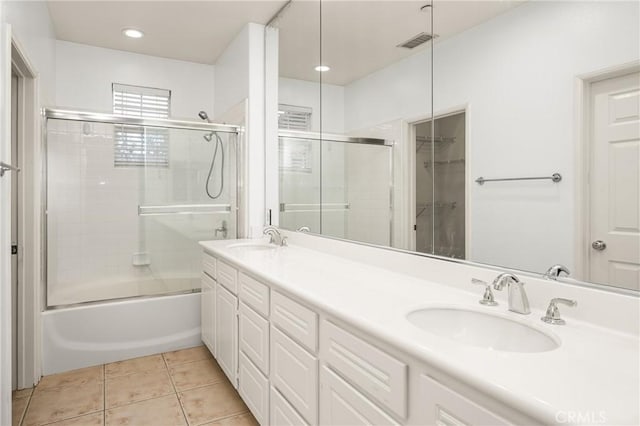 24 Dietes Ct, Ladera Ranch, CA 92694 - bathroom featuring double vanity, tile patterned flooring, and combined bath / shower with glass door