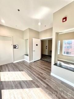 838 Pine Ave Unit 510, Long Beach, CA 90813 - unfurnished living room with wood finished floors and baseboards