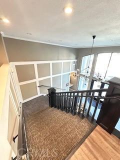 838 Pine Ave Unit 510, Long Beach, CA 90813 - stairway with wood finished floors and ornamental molding