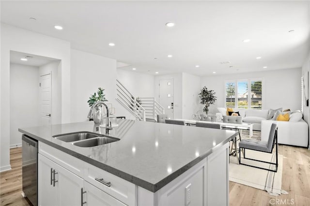 148 Modjeska, Irvine, CA 92618 - kitchen with dishwasher, open floor plan, a center island with sink, light wood-style floors, and recessed lighting