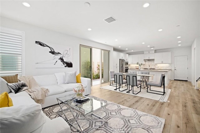 148 Modjeska, Irvine, CA 92618 - living area featuring recessed lighting and light wood-style flooring