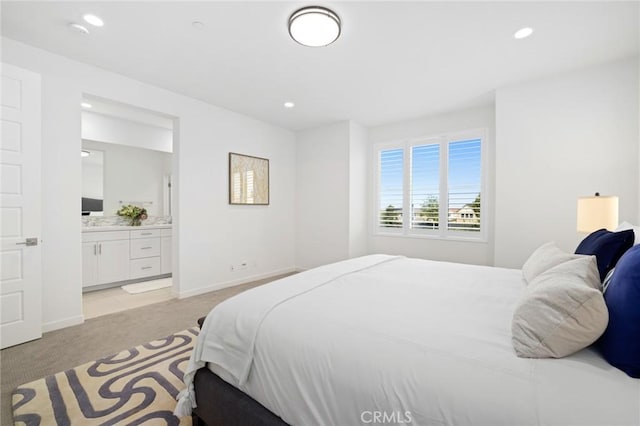 148 Modjeska, Irvine, CA 92618 - bedroom with light carpet, recessed lighting, and ensuite bath