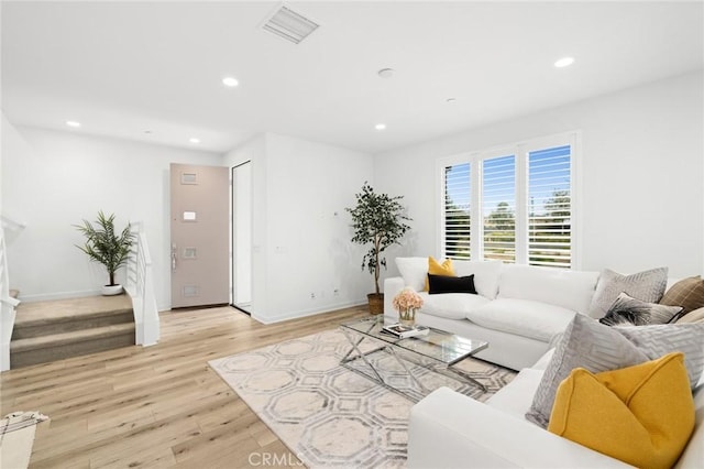 148 Modjeska, Irvine, CA 92618 - living room with recessed lighting, light wood-style flooring, and stairs