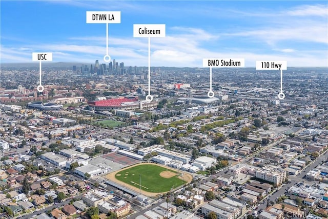 birds eye view of property featuring a city view