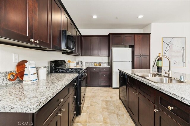 1437 Girona Dr, Pomona, CA 91766 - kitchen featuring black appliances, a sink, dark brown cabinetry, recessed lighting, and light stone counters