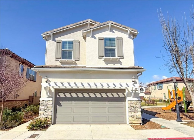 1437 Girona Dr, Pomona, CA 91766 - view of front facade featuring an attached garage, stucco siding, and stone siding
