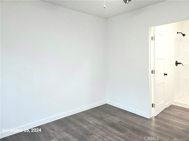 7030 Ramsgate Ave, Los Angeles, CA 90045 - unfurnished room featuring baseboards and dark wood-style flooring
