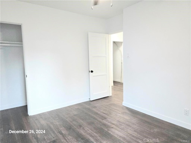 7030 Ramsgate Ave, Los Angeles, CA 90045 - unfurnished bedroom with wood finished floors, a closet, and baseboards