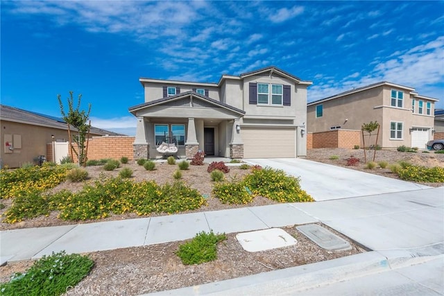 19568 Sunkissed Ridge Dr, Riverside, CA 92507 - craftsman-style house with stucco siding, a porch, driveway, a garage, and stone siding