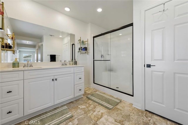 19568 Sunkissed Ridge Dr, Riverside, CA 92507 - full bathroom with a shower stall, vanity, recessed lighting, and stone finish floors