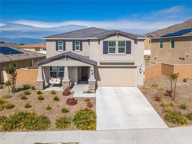 19568 Sunkissed Ridge Dr, Riverside, CA 92507 - view of front facade with stucco siding, a porch, fence, and concrete driveway