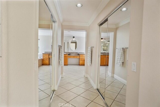 29086 Madrid Pl, Castaic, CA 91384 - hallway with light tile patterned floors, ornamental molding, and recessed lighting