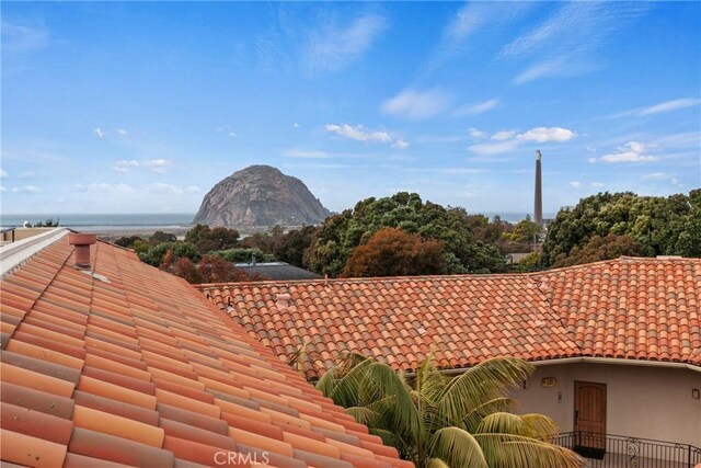 600 Morro Bay Blvd Unit 303, Morro Bay, CA 93442 - exterior view of a tile roof and a mountain backdrop