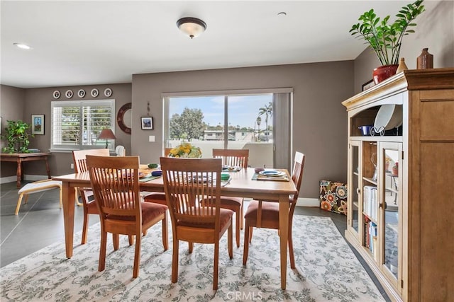 dining space with recessed lighting and baseboards