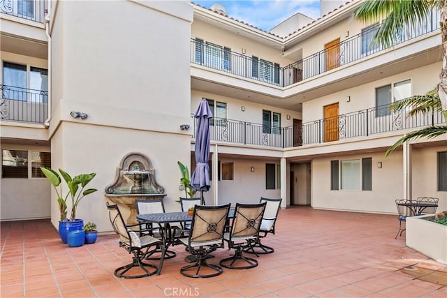 view of patio featuring a balcony