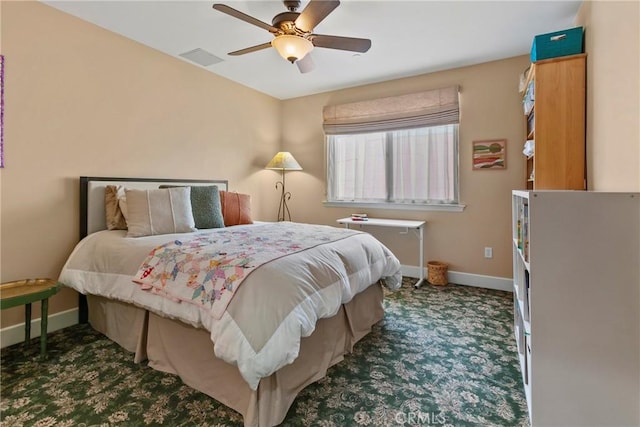 bedroom featuring visible vents, a ceiling fan, carpet flooring, and baseboards