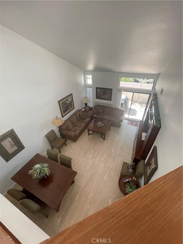 18269 Sanmian Ct, Fountain Valley, CA 92708 - living area featuring wood finished floors and a tiled fireplace