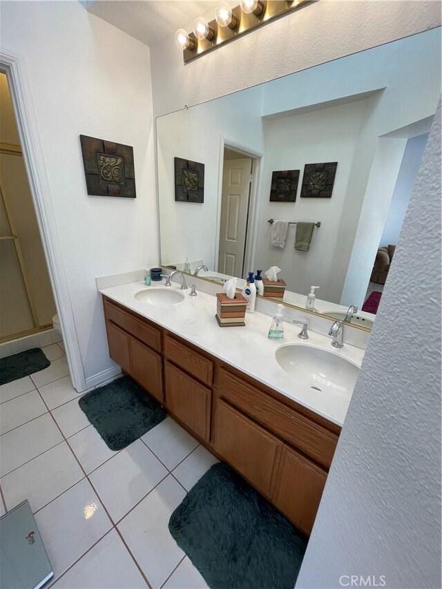 18269 Sanmian Ct, Fountain Valley, CA 92708 - bathroom featuring tile patterned flooring and double vanity