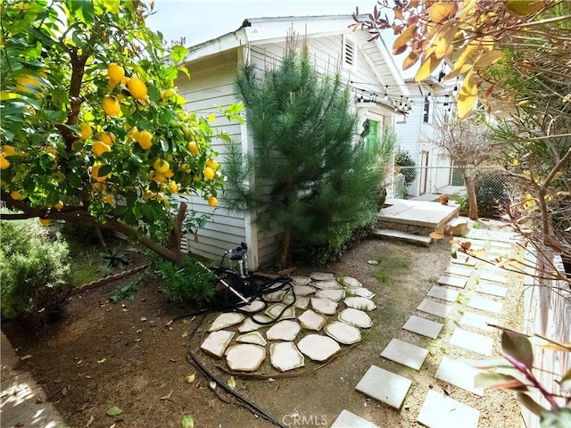 view of side of property with fence