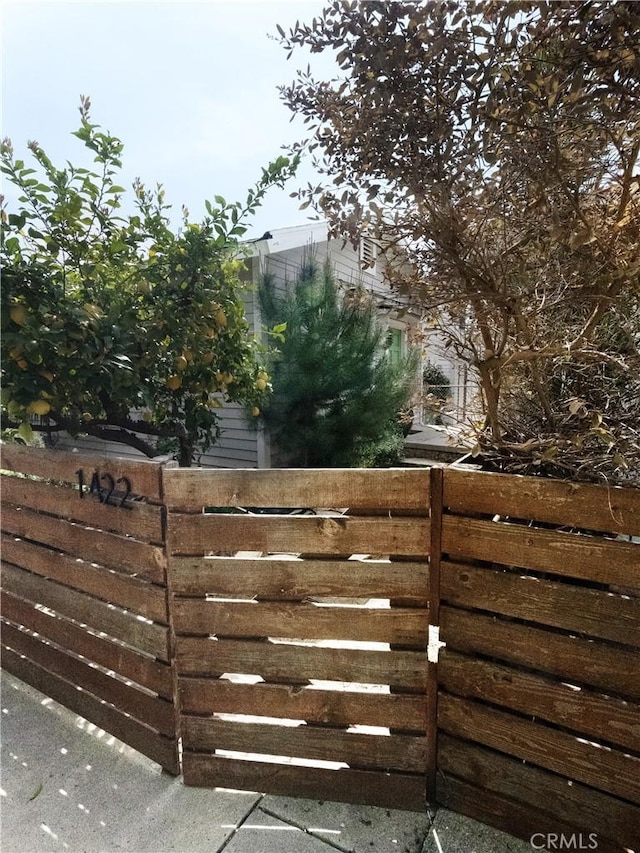 view of gate with fence