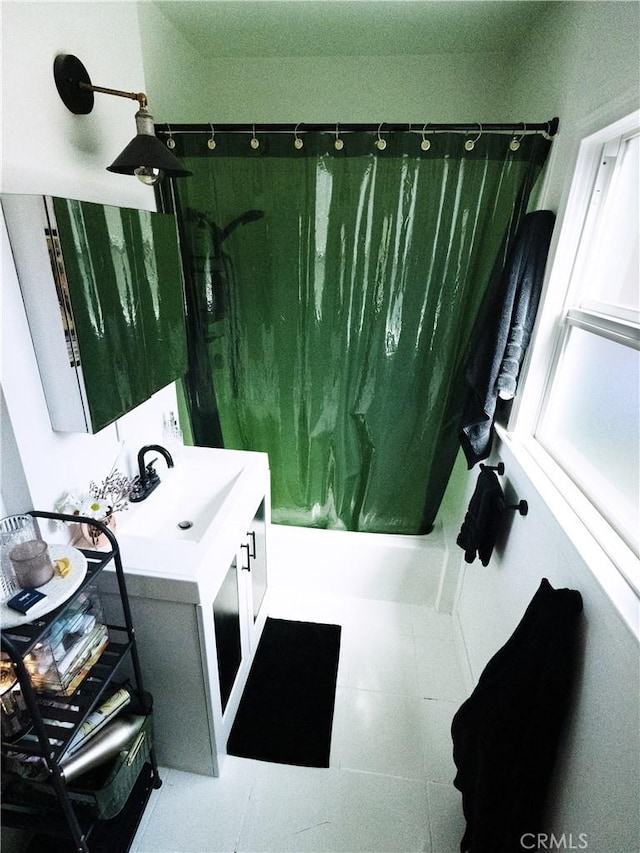full bath featuring vanity and shower / tub combo