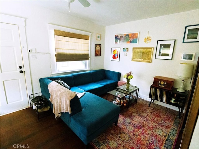 living room featuring wood finished floors and a ceiling fan