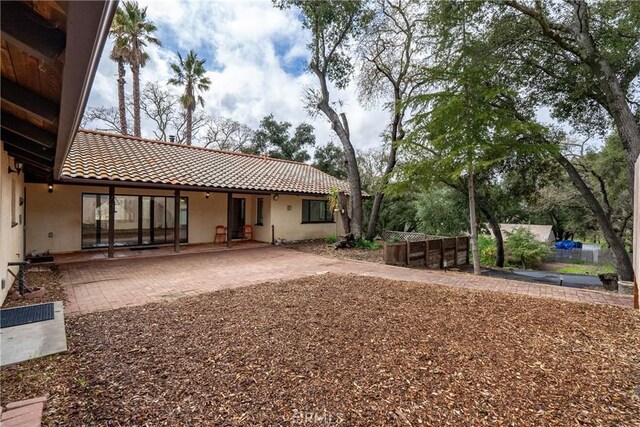 13155 San Antonio Rd, Atascadero, CA 93422 - rear view of house featuring a patio, a tiled roof, and stucco siding