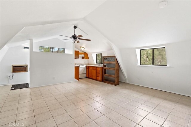 13155 San Antonio Rd, Atascadero, CA 93422 - unfurnished living room featuring a wall mounted AC, a sink, light tile patterned flooring, lofted ceiling, and ceiling fan