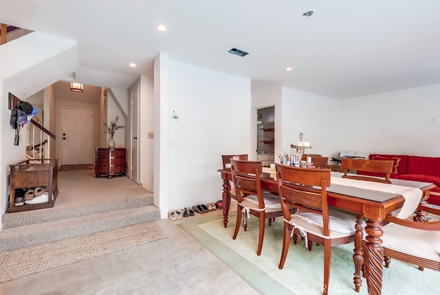 dining space with recessed lighting and concrete flooring