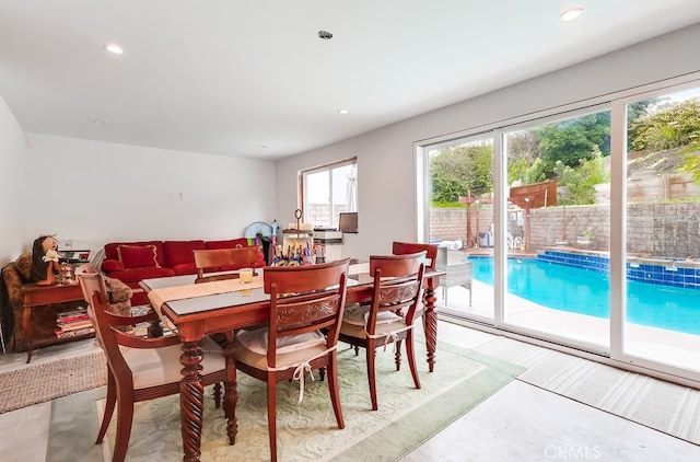 dining space featuring recessed lighting and concrete floors