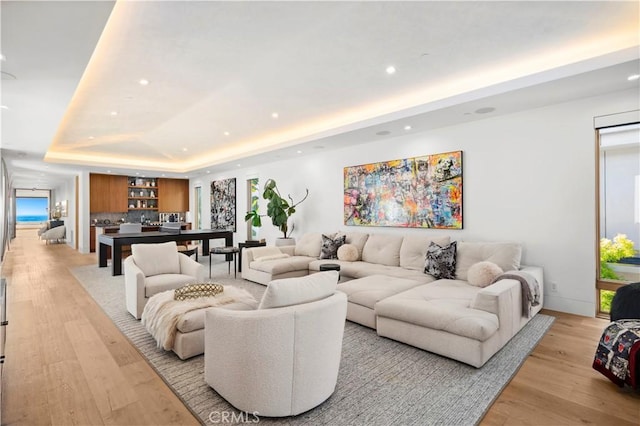 2914 Ocean Blvd, Corona Del Mar, CA 92625 - living room with recessed lighting, a raised ceiling, and light wood-style floors