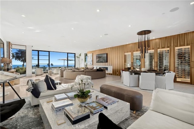 2914 Ocean Blvd, Corona Del Mar, CA 92625 - living room with recessed lighting, wood walls, and floor to ceiling windows