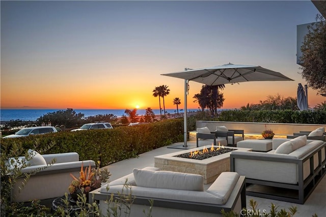2914 Ocean Blvd, Corona Del Mar, CA 92625 - patio terrace at dusk featuring an outdoor living space with a fire pit
