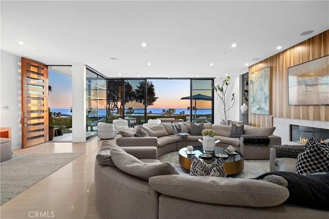 2914 Ocean Blvd, Corona Del Mar, CA 92625 - living area with recessed lighting, expansive windows, a glass covered fireplace, and wood walls