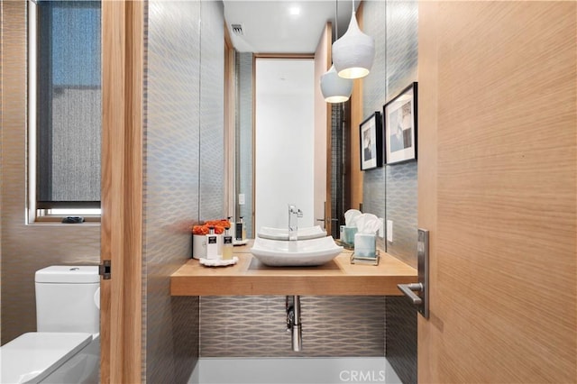 2914 Ocean Blvd, Corona Del Mar, CA 92625 - half bath with visible vents, toilet, and a sink