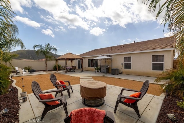 29068 Aubrey Cir, Winchester, CA 92596 - view of patio / terrace featuring an outdoor fire pit, central AC, a gazebo, and fence