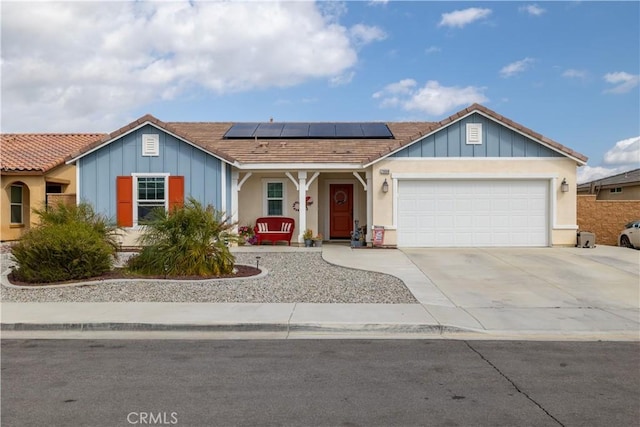 29068 Aubrey Cir, Winchester, CA 92596 - single story home featuring solar panels, driveway, a garage, and board and batten siding