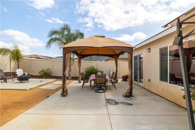 29068 Aubrey Cir, Winchester, CA 92596 - view of patio with a fenced backyard, a fire pit, and outdoor dining space