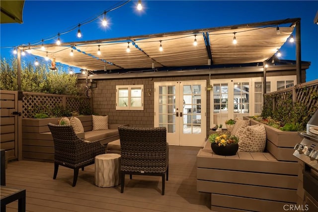 604 Begonia Ave, Corona Del Mar, CA 92625 - patio at twilight featuring outdoor lounge area, fence, french doors, and a deck