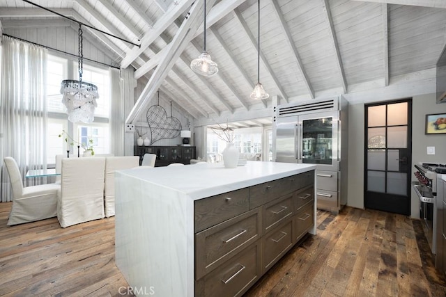 604 Begonia Ave, Corona Del Mar, CA 92625 - kitchen featuring a center island, high vaulted ceiling, an inviting chandelier, and hardwood / wood-style floors