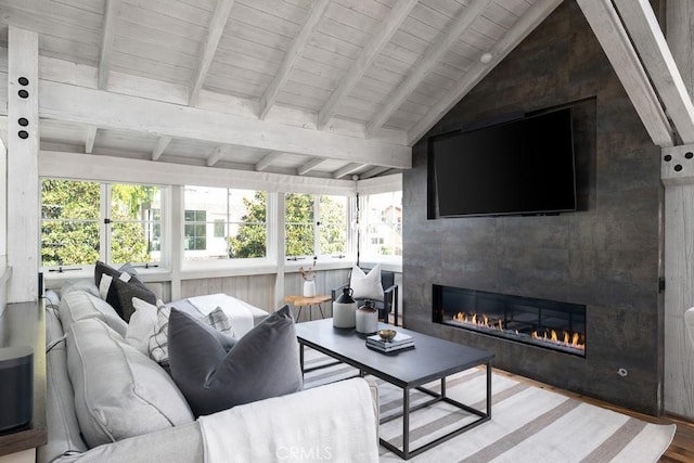 604 Begonia Ave, Corona Del Mar, CA 92625 - living room featuring lofted ceiling with beams, a wealth of natural light, wood finished floors, and a tile fireplace