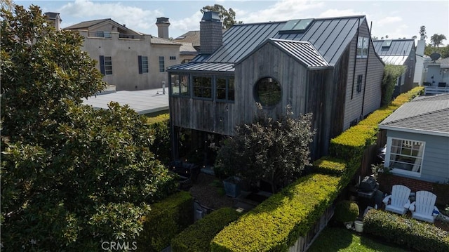 604 Begonia Ave, Corona Del Mar, CA 92625 - exterior space featuring a standing seam roof, metal roof, a chimney, a deck, and a residential view